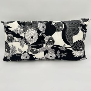 Handmade black and white floral print modish pillow with large button in center.