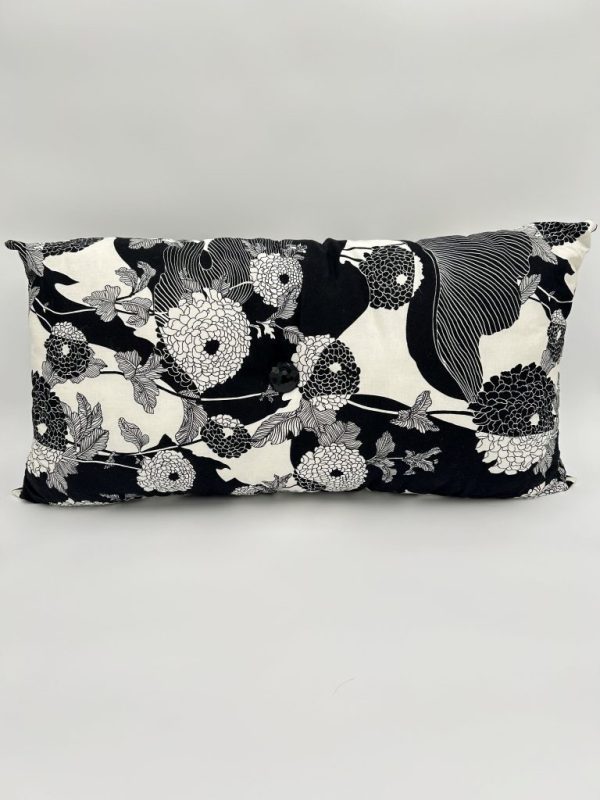 Handmade black and white floral print modish pillow with large button in center.