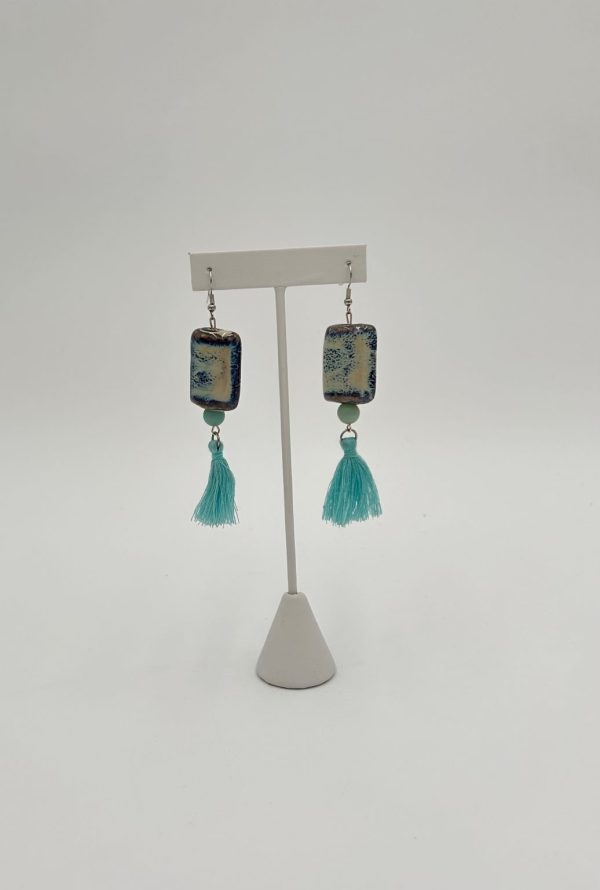 Sky blue tassel earrings with large blue and white jewelry bead