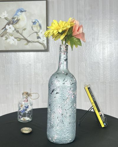 Hand painted blue teal vase with colorful flowers inside