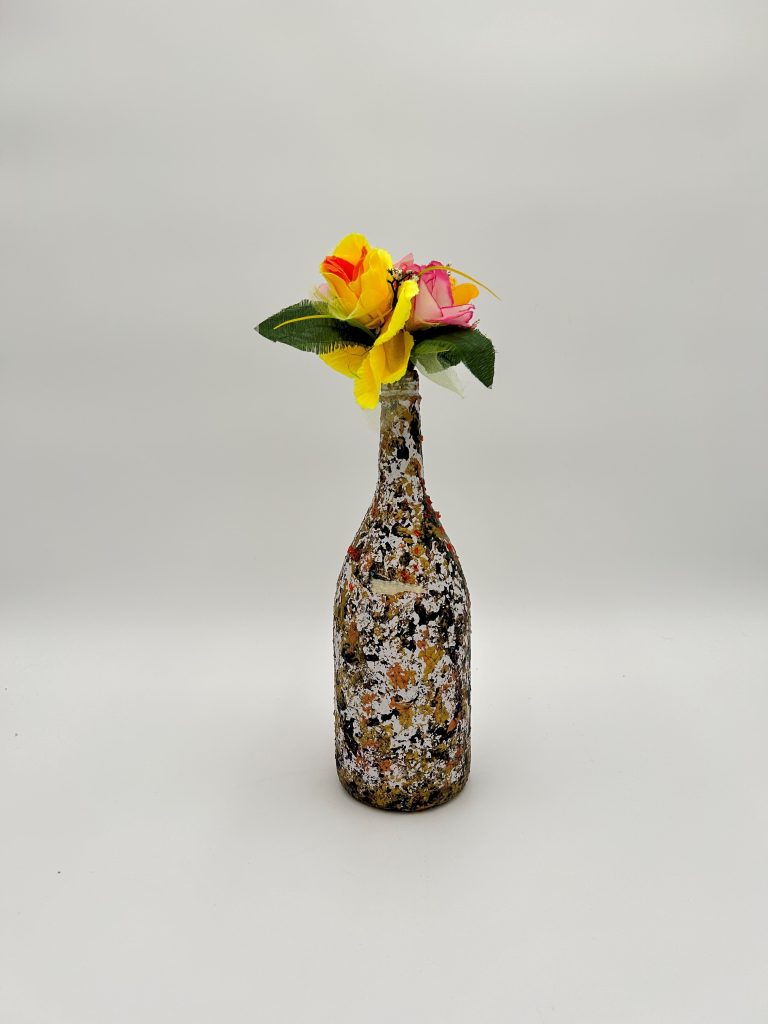 Brown multi color vase with traces of gray, orange and gold hand painted with yellow flowers.