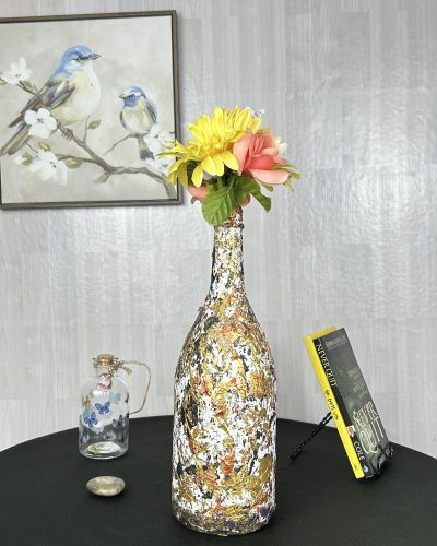 Hand painted brown multicolor vase with yellow flowers inside