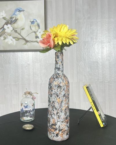 Hand painted gray glass vase with streaks of orange.
