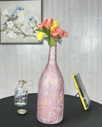 Hand painted pink floral vase with bright flowers inside