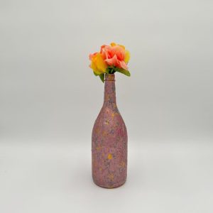 Glossy pink large decorative vase hand painted with colorful bouquet inside.