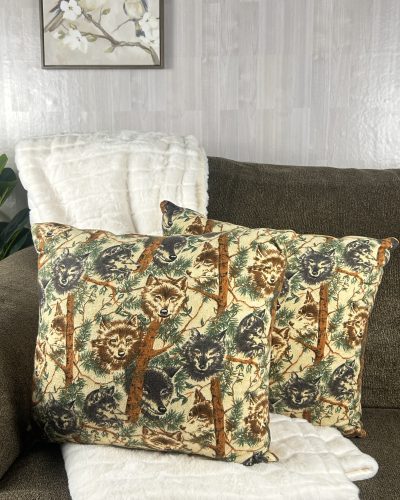 Handmade wolf pillow set of 2 on brown sofa with white blanket