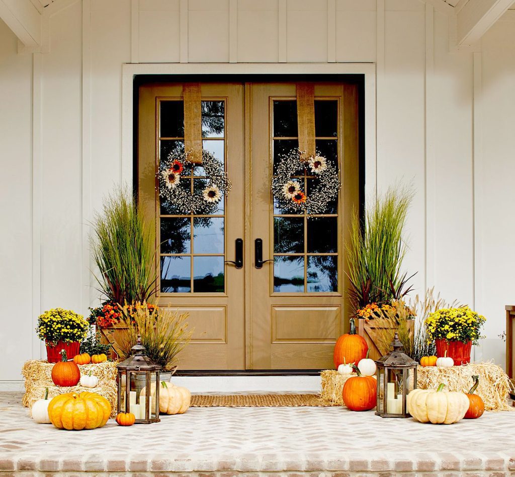 beautiful front porch decorated for fall season