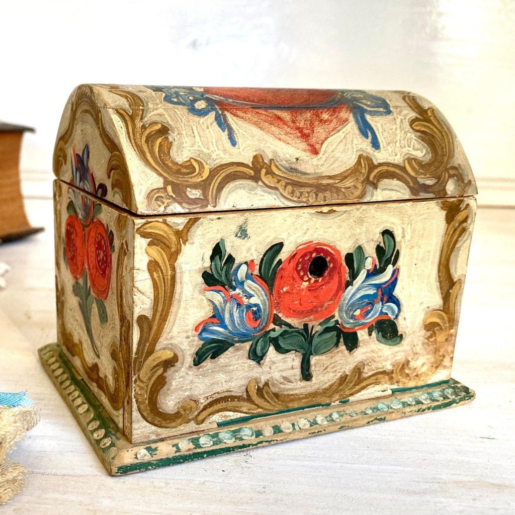 Hand painted jewelry box with scarlet flower on it and tan background