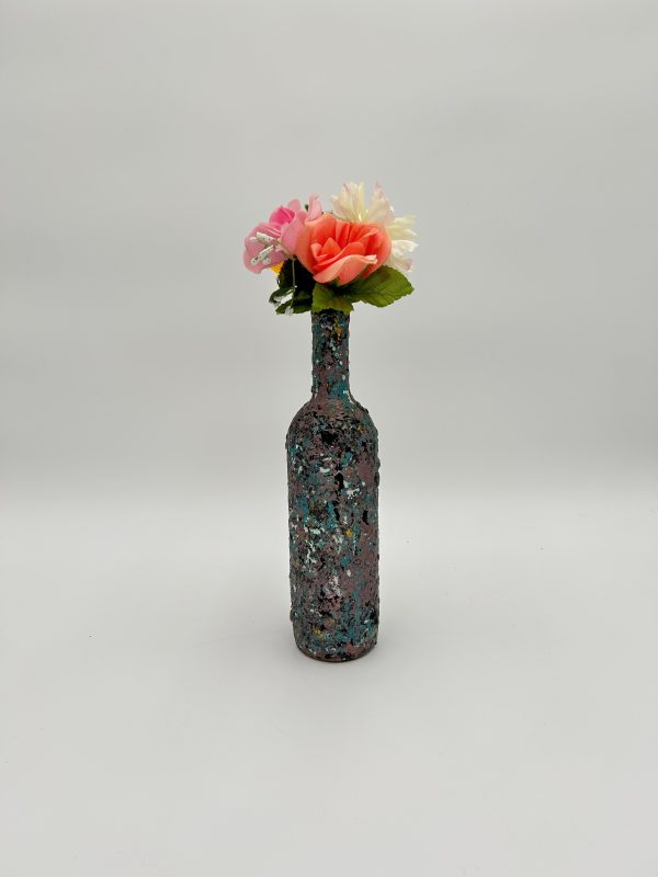 Handmade home decor purple and blue vase with flowers inside