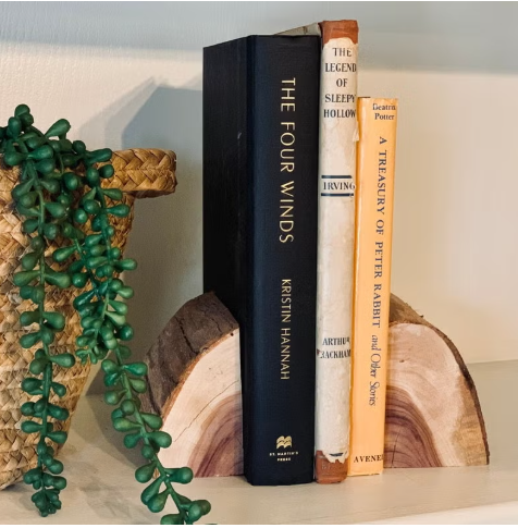 Handmade bookend holding up 3 books on a shelf in the home