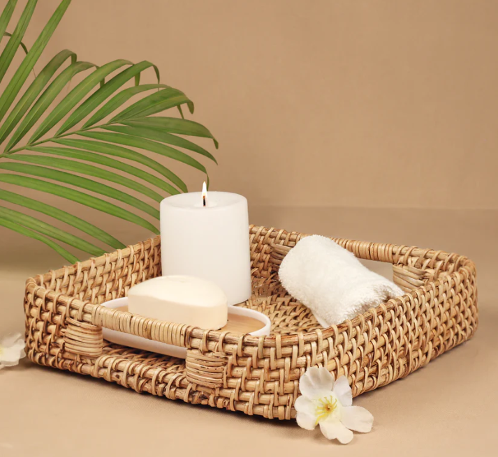 Hand woven table tray with home decor accents inside