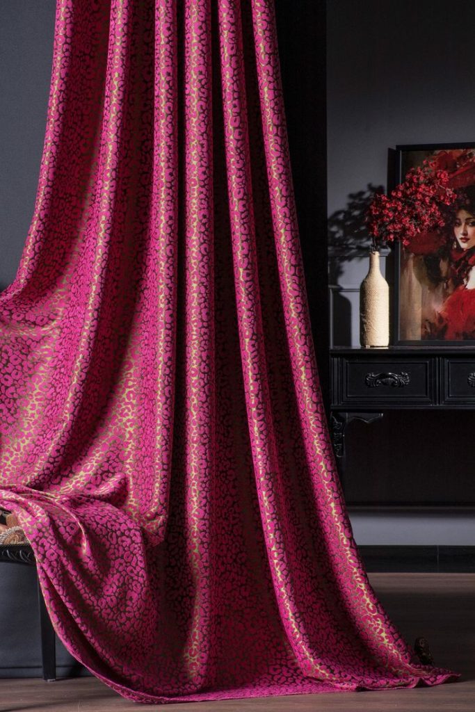 Dramatic cherry purple drapery in opera inspired living room