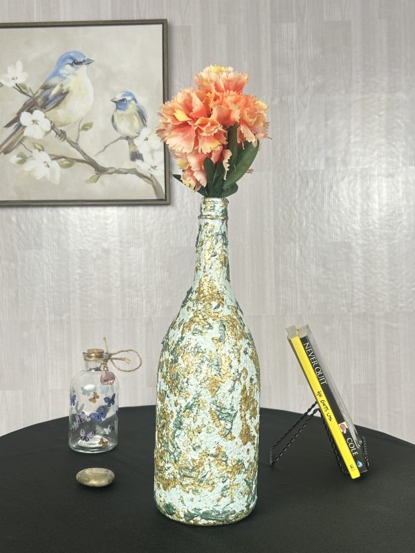 Green and gold vase hand painted with glittery with color bouquet inside
