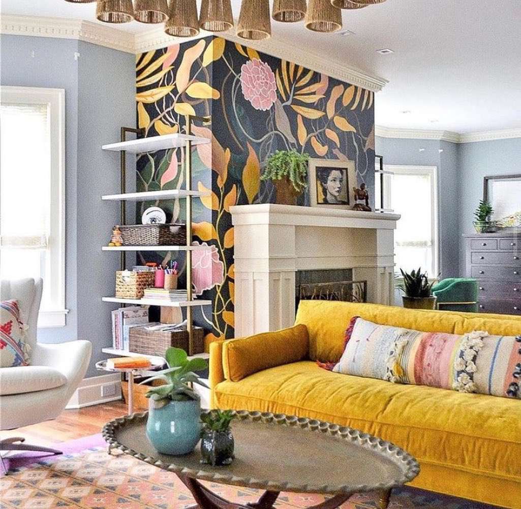 Dopamine inspired living room with a yellow sofa and a large wall painting